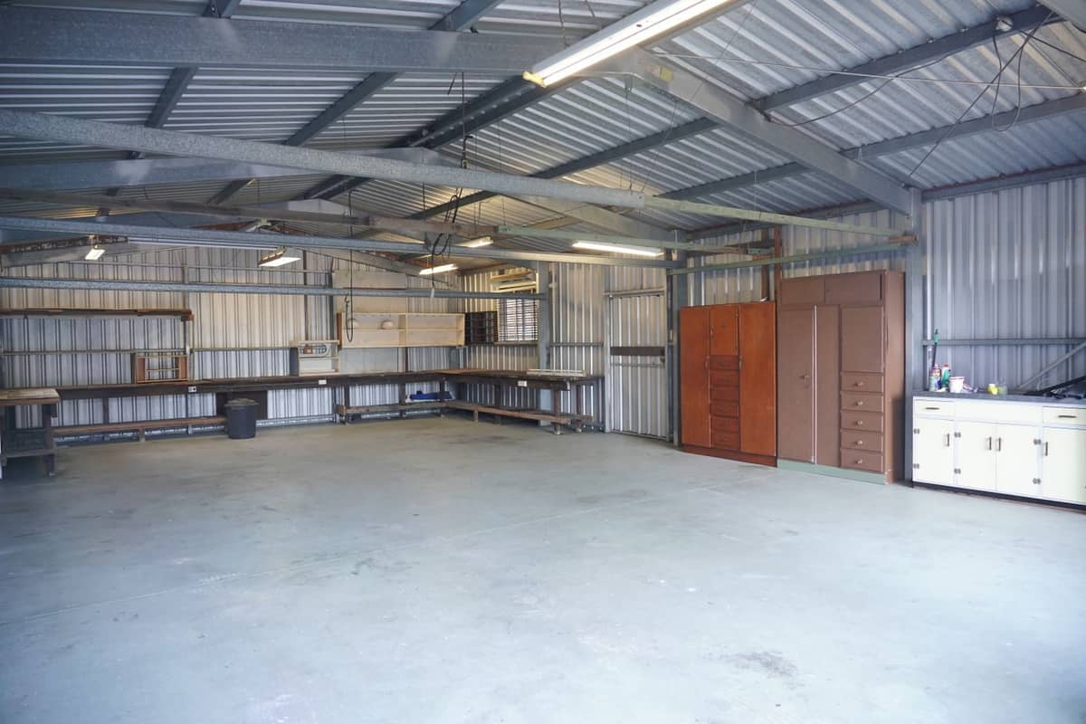 Empty steel shop building with metal wall panels and a smooth floor